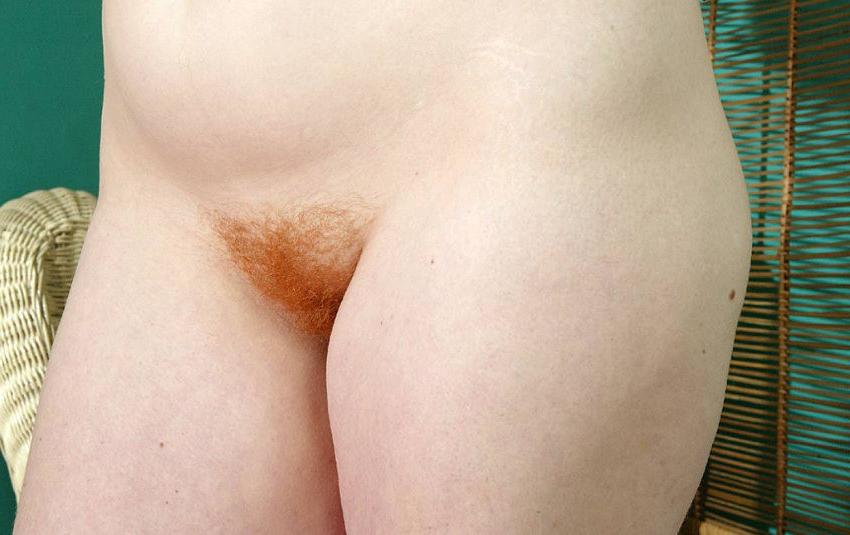 20P Curly redhead spreading her fat ass