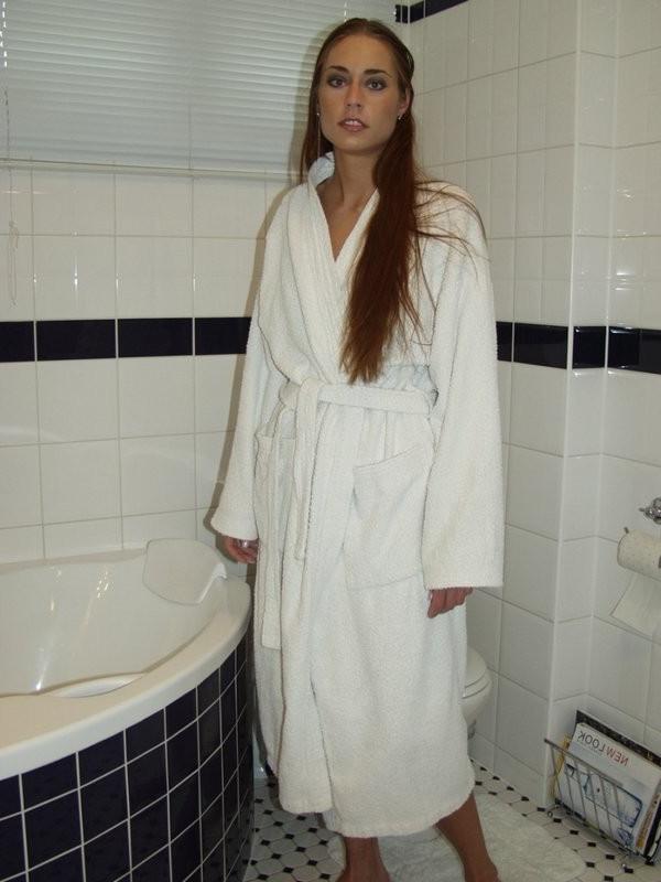 16P Cute brunette looses her robe in the bathroom and gives us a show
