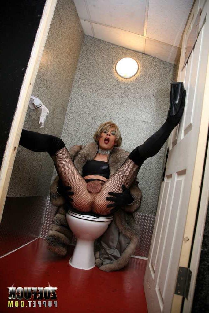 16P Tranny stroking her cock in a public bathroom