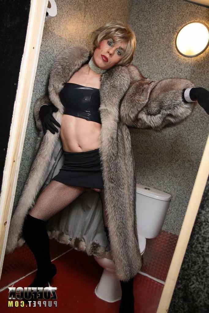 16P Tranny stroking her cock in a public bathroom