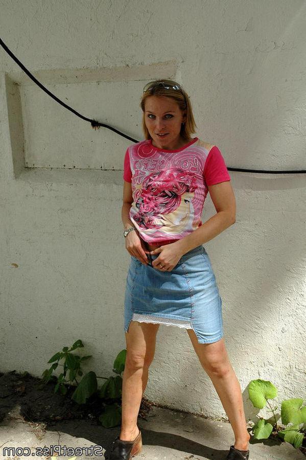 12P Leggy blonde in miniskirt wees in a deserted building