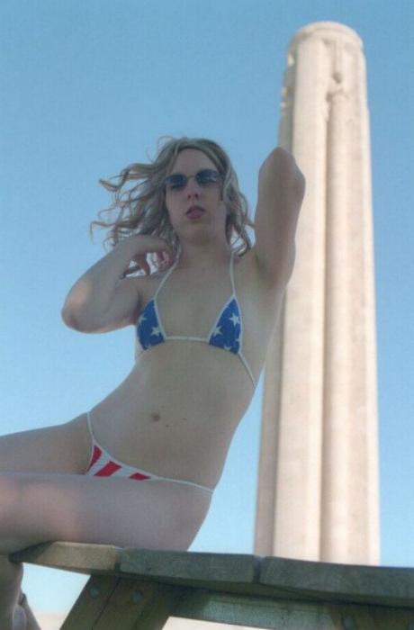 20P Curly blonde shows her tits outdoor