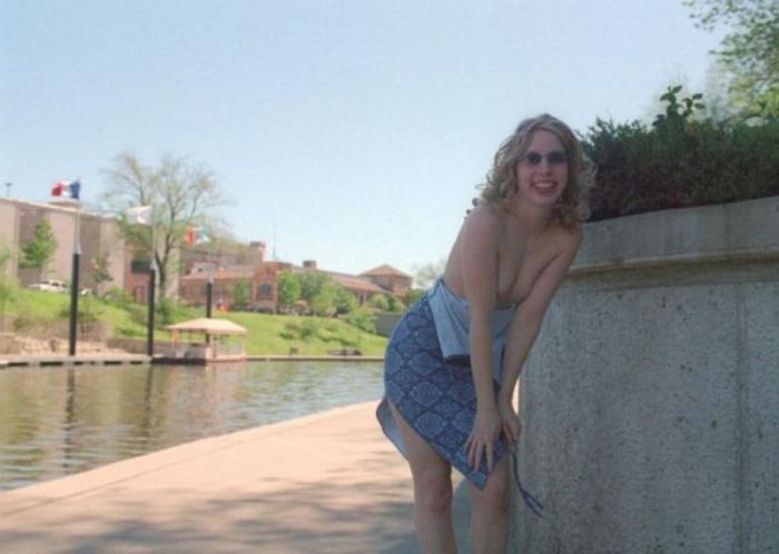 20P Curly blonde shows her tits outdoor