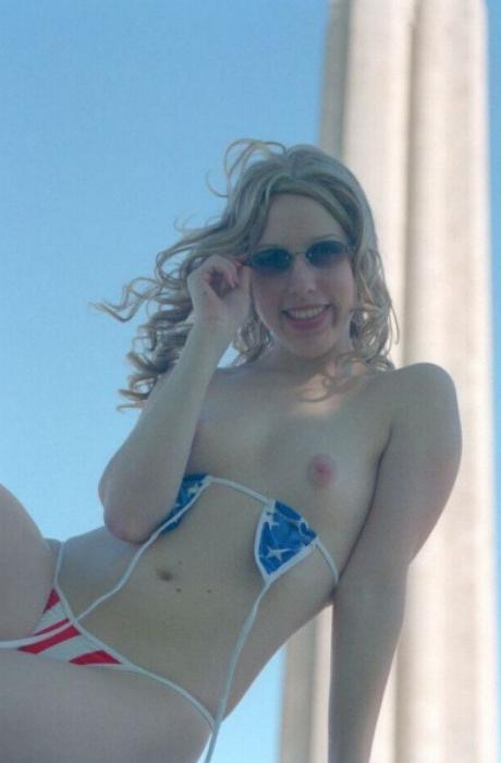 20P Curly blonde shows her tits outdoor
