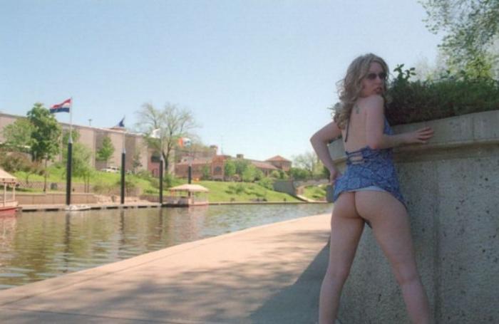 20P Curly blonde shows her tits outdoor