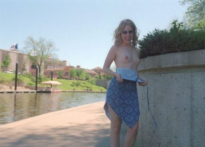 20P Curly blonde shows her tits outdoor