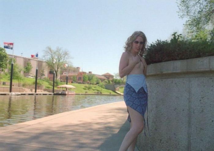 20P Curly blonde shows her tits outdoor