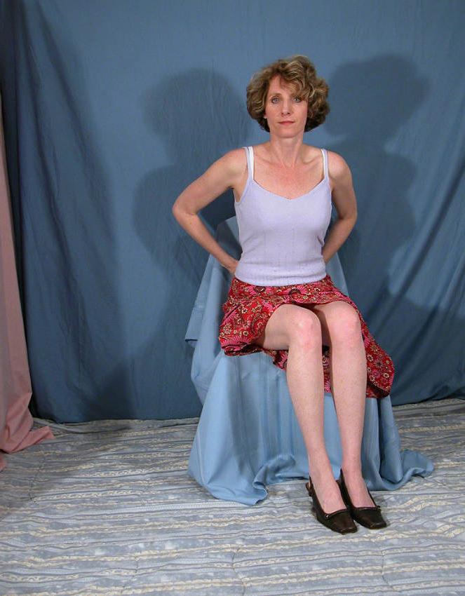 20P Curly mature beauty showing upskirt
