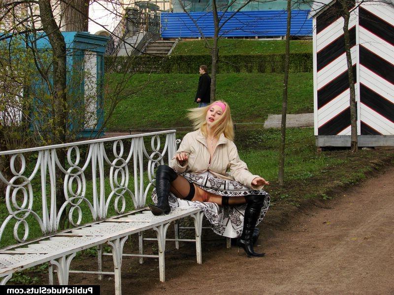 15P Busty bimbo has fun showing her nude boobs and pussy in public place