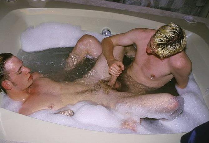 20P Blond and dark haired buds sucking treat while taking a bath