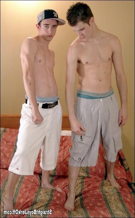 16P Two young guys jerking off together on a bed