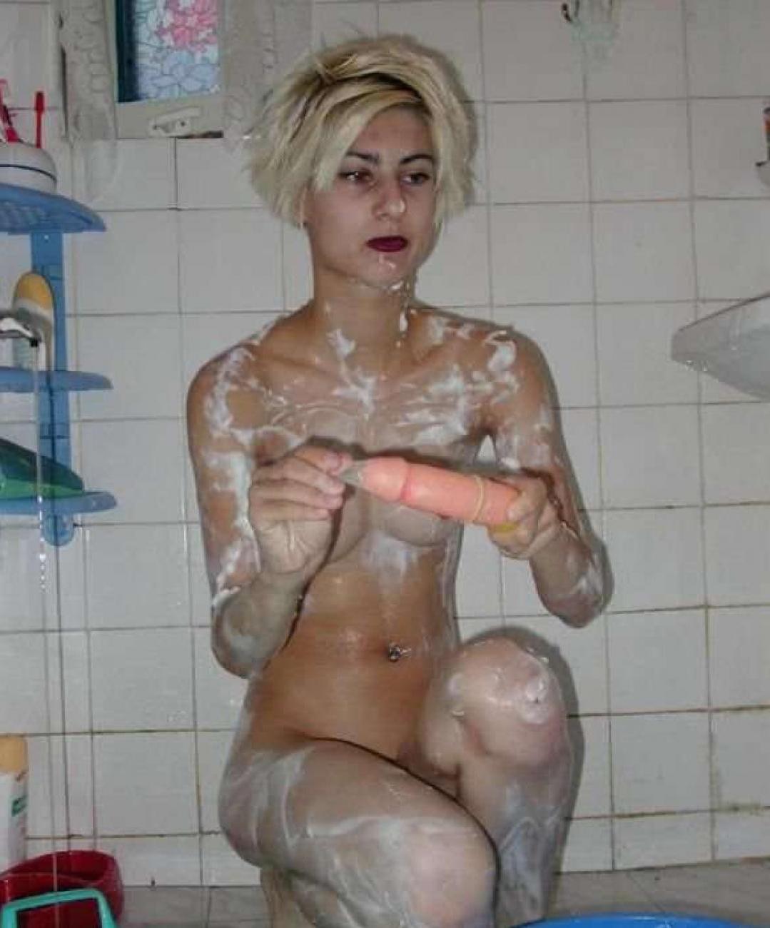 16P Pictures of an emo babe playing with herself in the bathroom