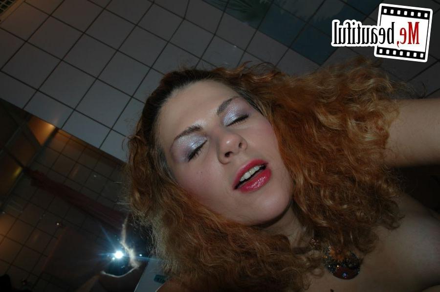 15P Redhead with curly long hair takes spicy pictures of her slim nudity