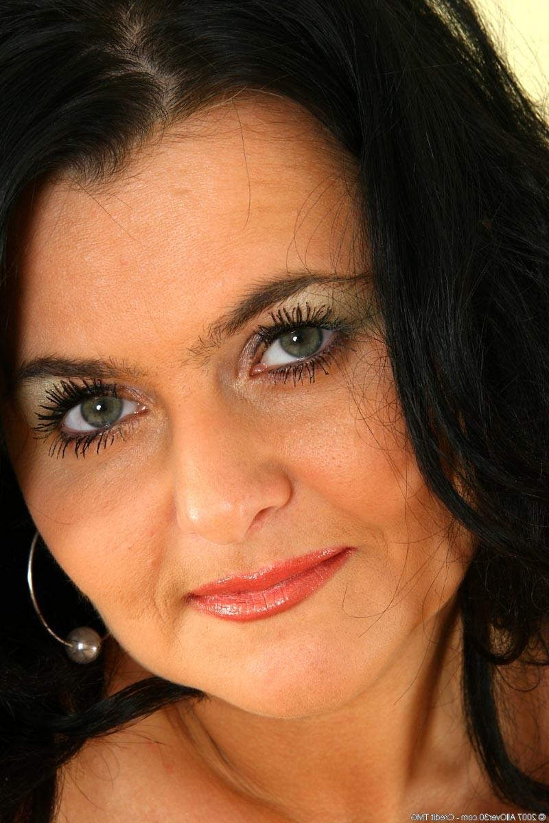 15P Curvy brunette milf licks her massive natural juggs