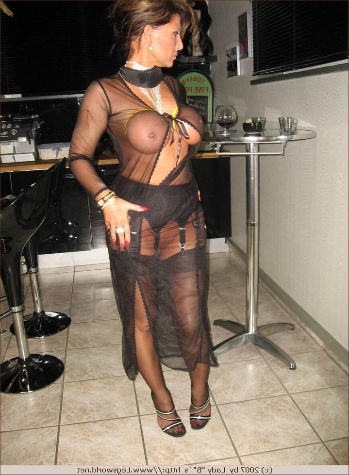 12P Glamour lady in stockings shows shaved pussie