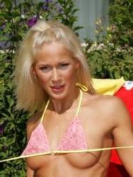 15P Sun bathing beauty plays with her pink vibrator