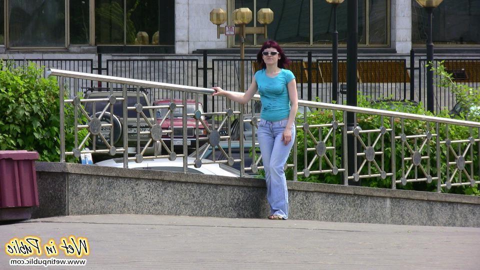12P Red-haired chick wets her pants and changes outdoors flashing her pussy