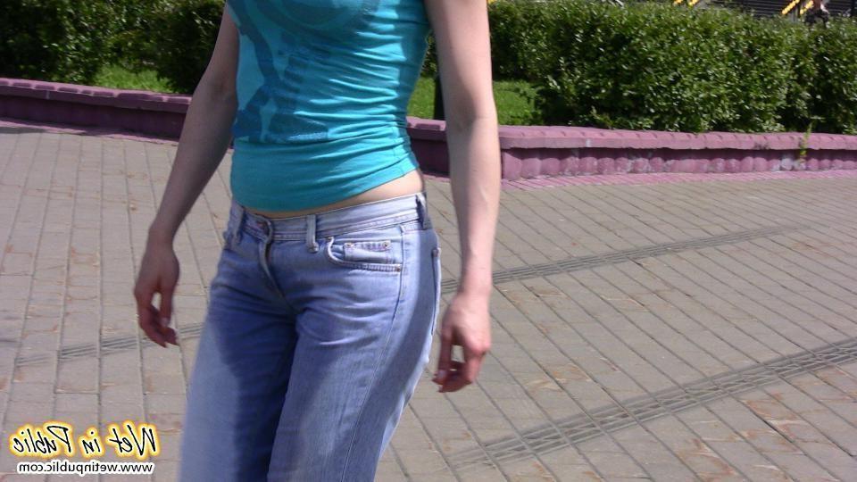 12P Red-haired chick wets her pants and changes outdoors flashing her pussy