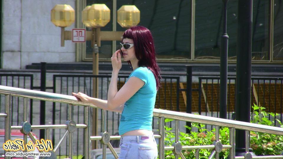 12P Red-haired chick wets her pants and changes outdoors flashing her pussy