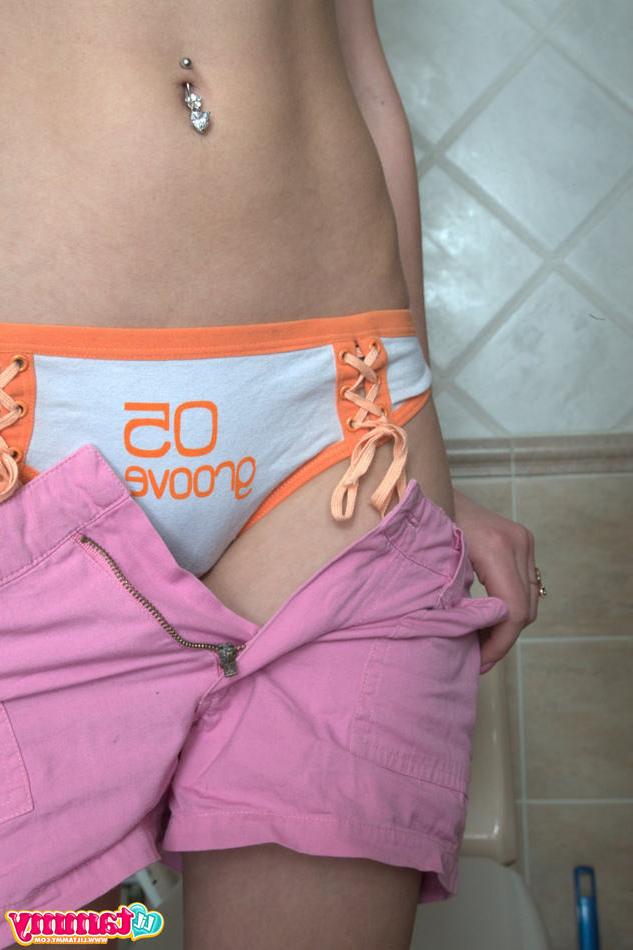 15P Tiny titted eighteen year old spreads legs on toilet in bathroom