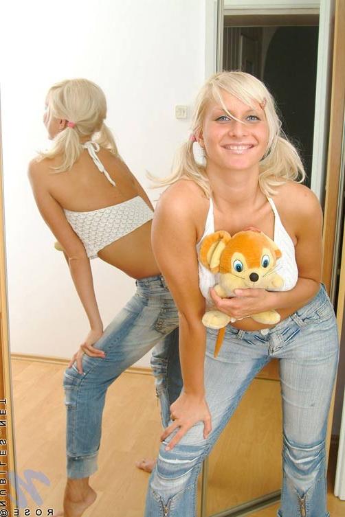 14P Cute teen blonde caresses her tits in front of a mirror just playing and making 