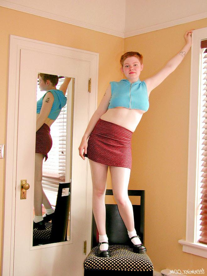 18P Short haired redhead teen cutie in a skirt shows her fire crotch