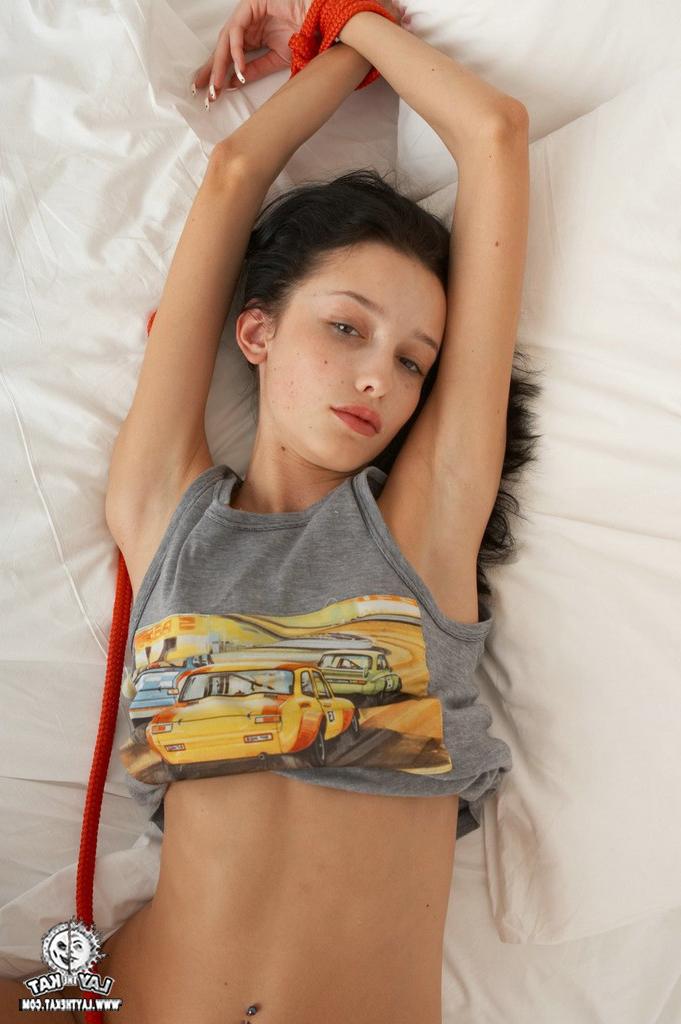 15P Black haired young chick with tied hands