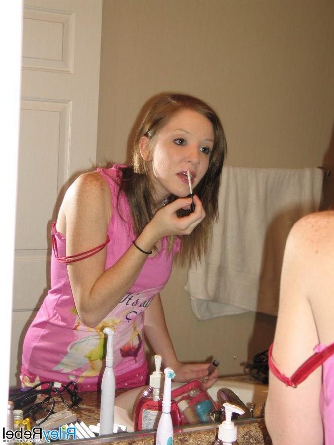 16P Redhead Riley Rebel gets ready in the bathroom