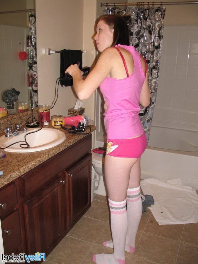 16P Redhead Riley Rebel gets ready in the bathroom