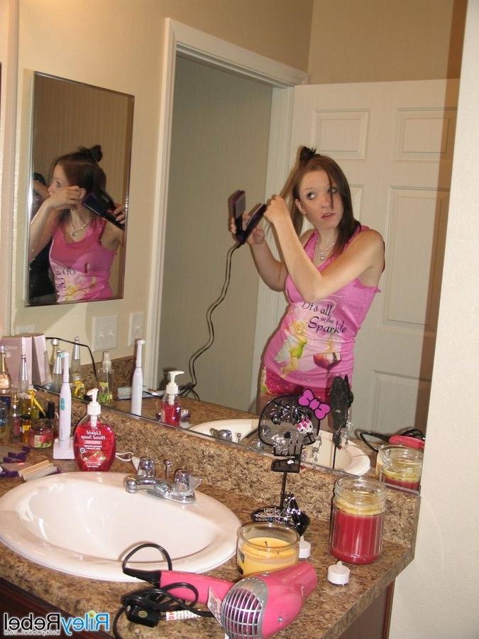16P Redhead Riley Rebel gets ready in the bathroom