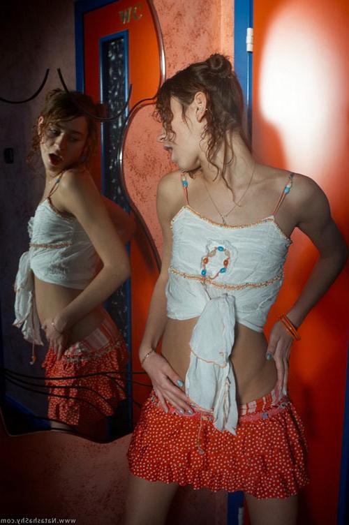 17P Beautiful curly redhead teenie pulling down all her garments