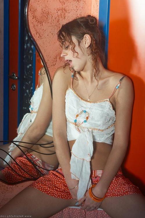 17P Beautiful curly redhead teenie pulling down all her garments