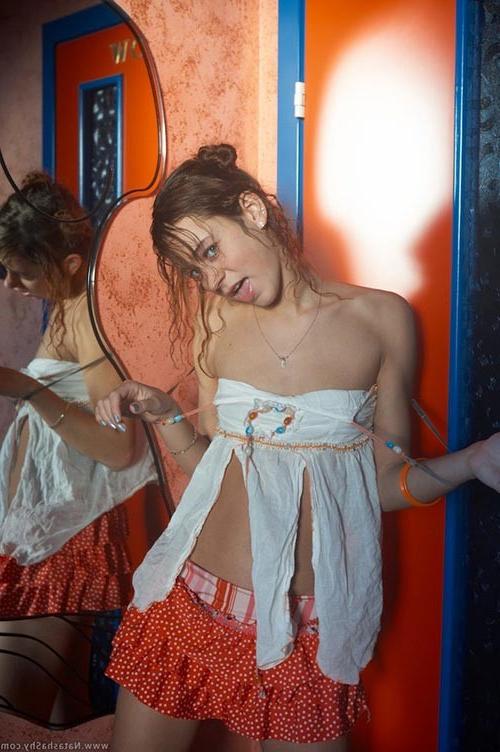 17P Beautiful curly redhead teenie pulling down all her garments