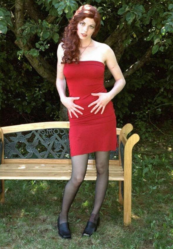 20P Curly redhead cutie showing upskirt
