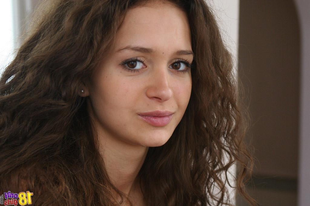 15P Sweet young curly brunette stripping