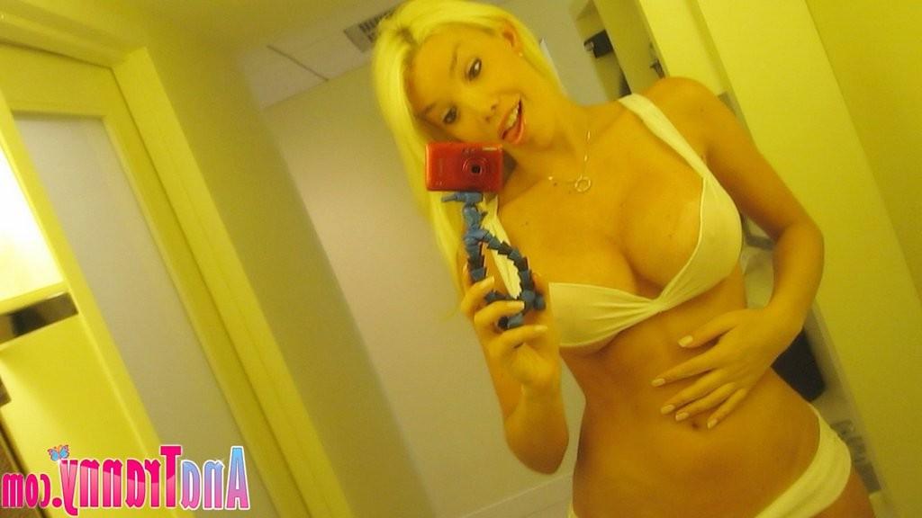 16P Busty blonde transsexual takes self pics in mirror