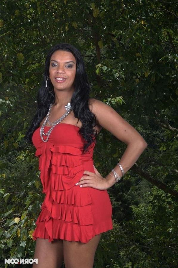 16P A dark Brazilian tranny strips out of her red dress
