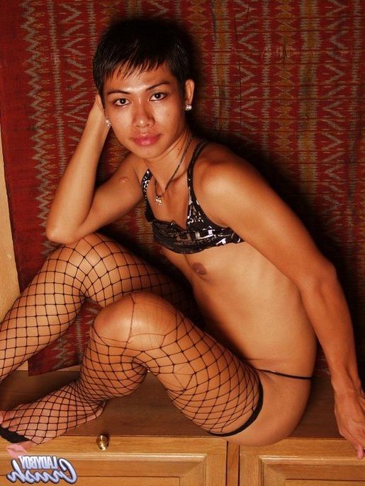 15P Petite pixie haired ladyboy looking sexy in fishnets