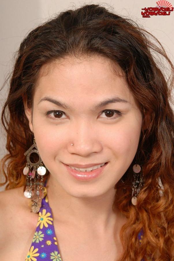 16P Curly Haired Asian Ladyboy Spreads Wide On The Bed