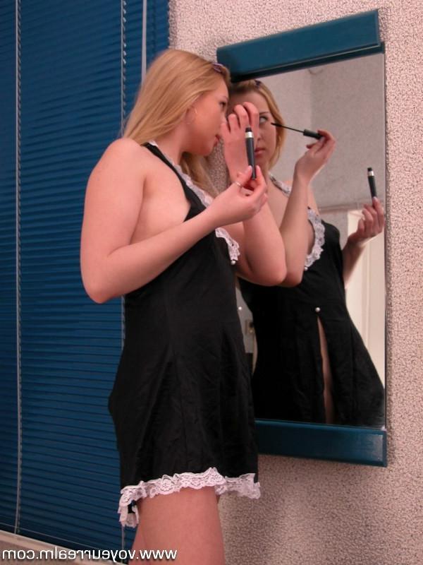 15P Blonde applying body oil onto her booty