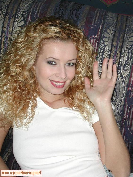 13P Curly hair babe inserts a red dildo into her furry vagina