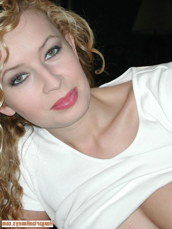 13P Curly hair babe inserts a red dildo into her furry vagina