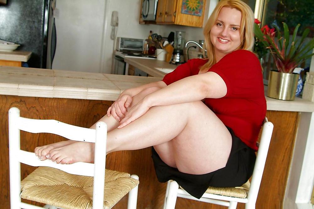 15P Busty  blonde shows off her pedicure 