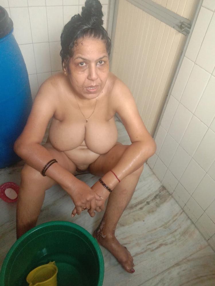 23P Mature woman bathing