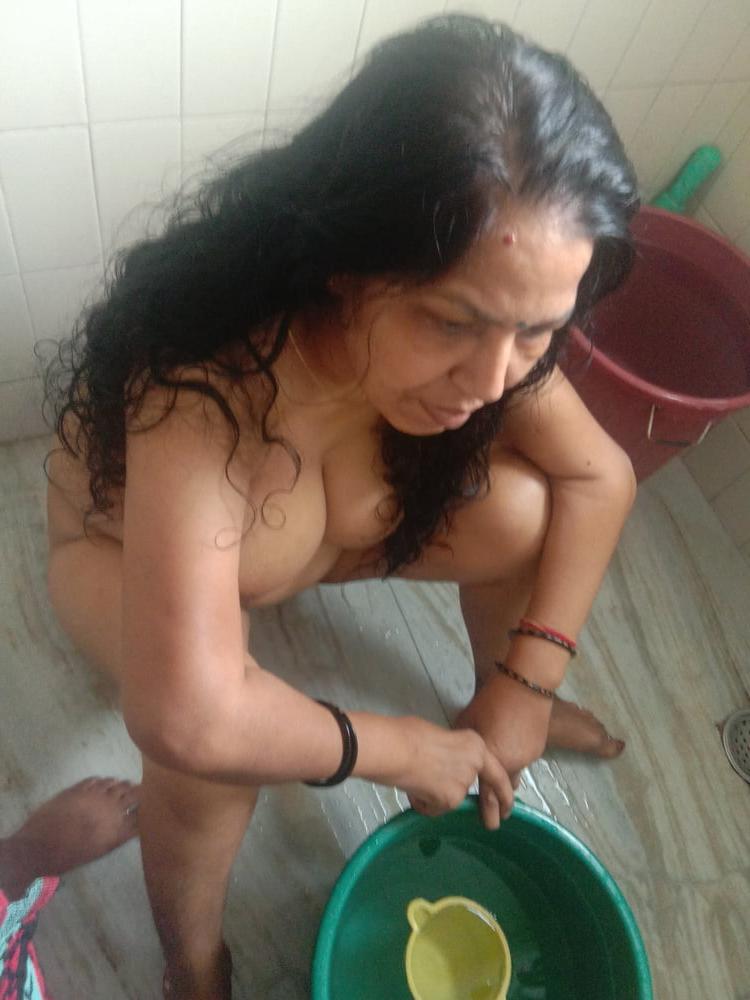 23P Mature woman bathing