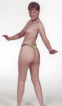 7P Cute redhead teen posing