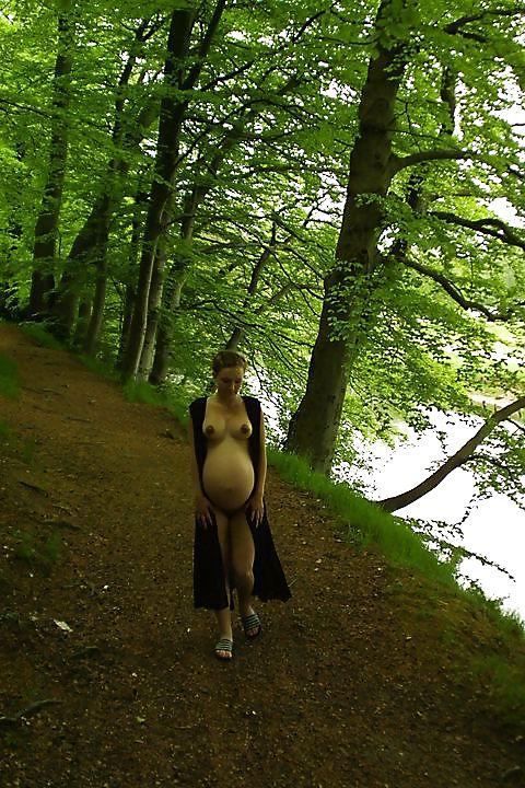 25P Cute pregger taking a walk in the forest