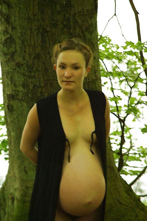 25P Cute pregger taking a walk in the forest