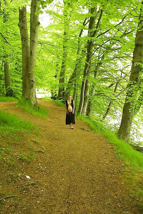 25P Cute pregger taking a walk in the forest