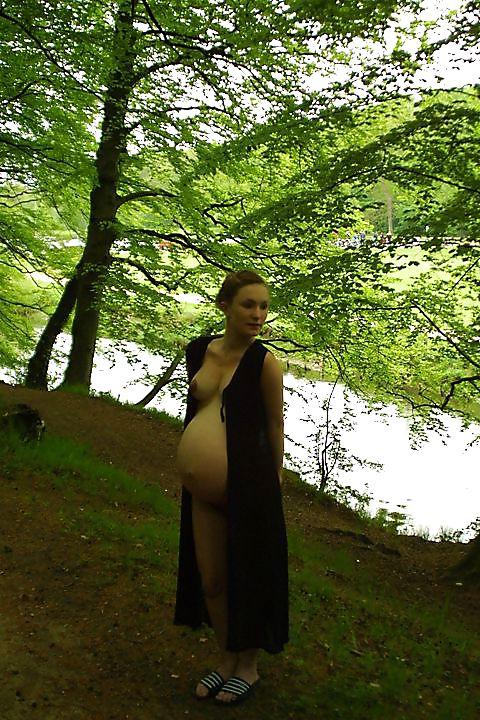 25P Cute pregger taking a walk in the forest